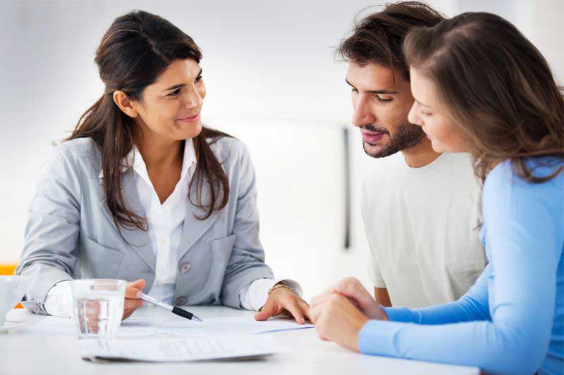 Couple discussing 30-year fixed home loan with loan advisor